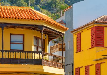 Colorful buildings on a narrow street in spanish town Garachico on a sunny day, Tenerife, Canary islands, Spain